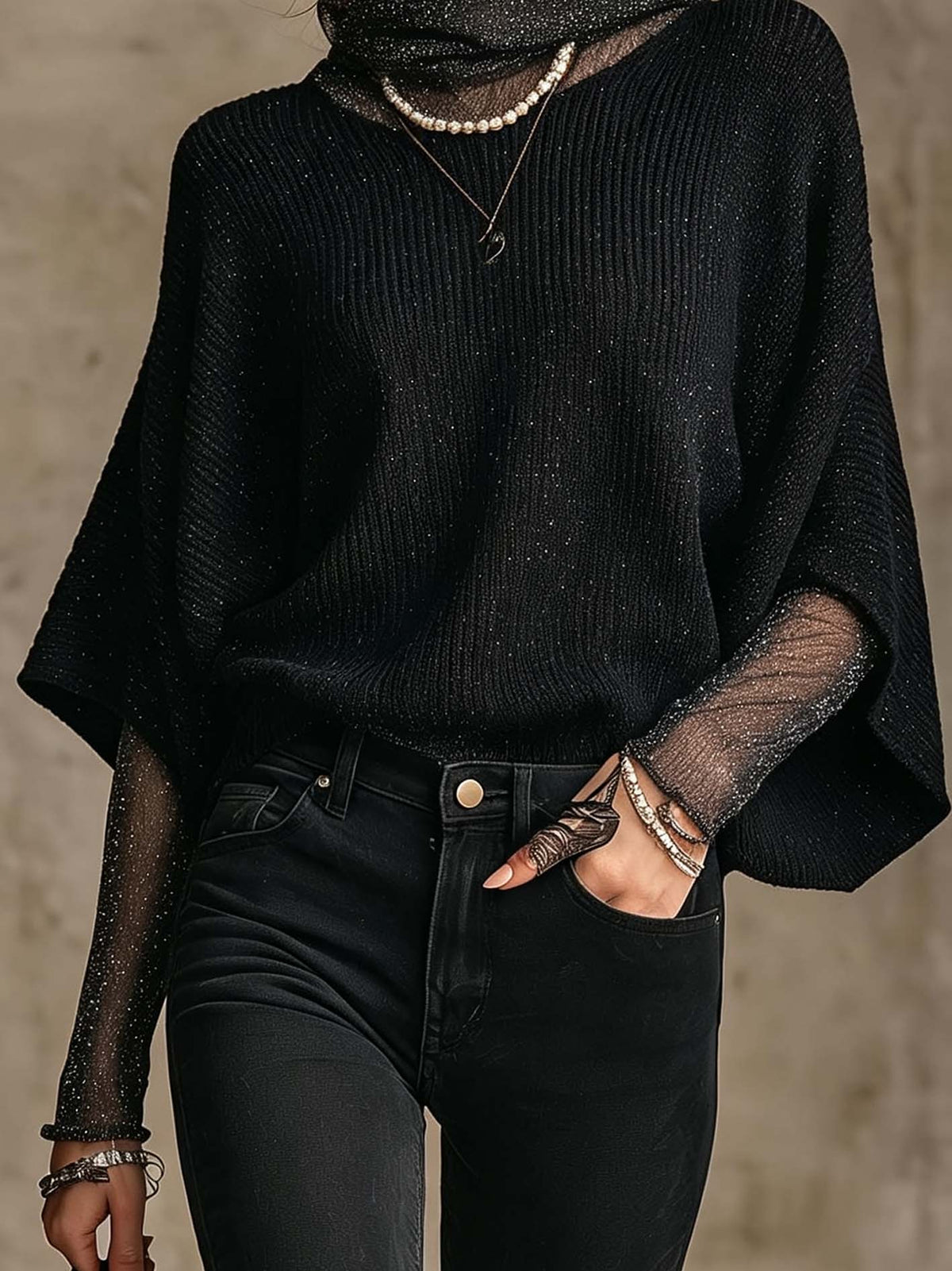 Pull noir en maille brillante