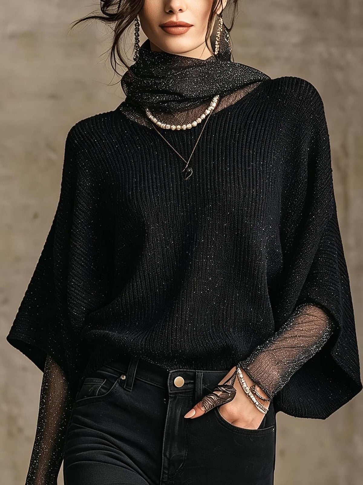 Pull noir en maille brillante