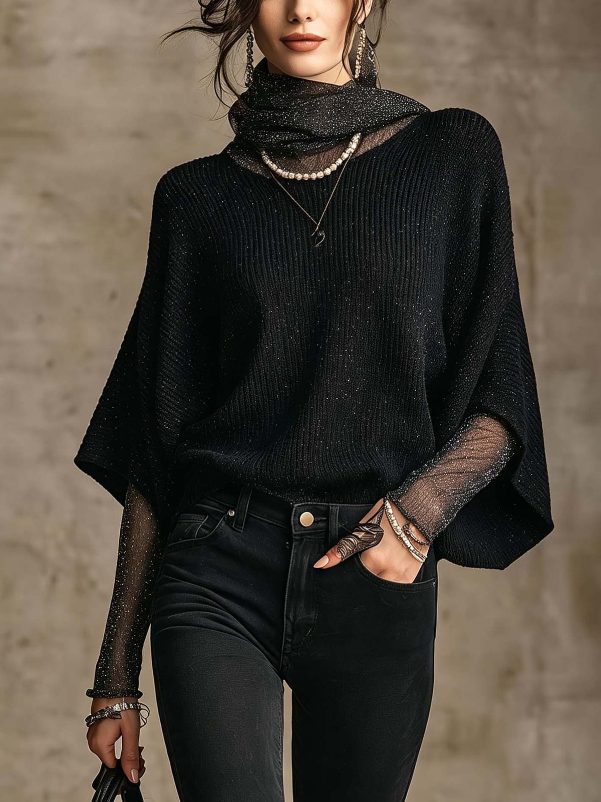 Pull noir en maille brillante